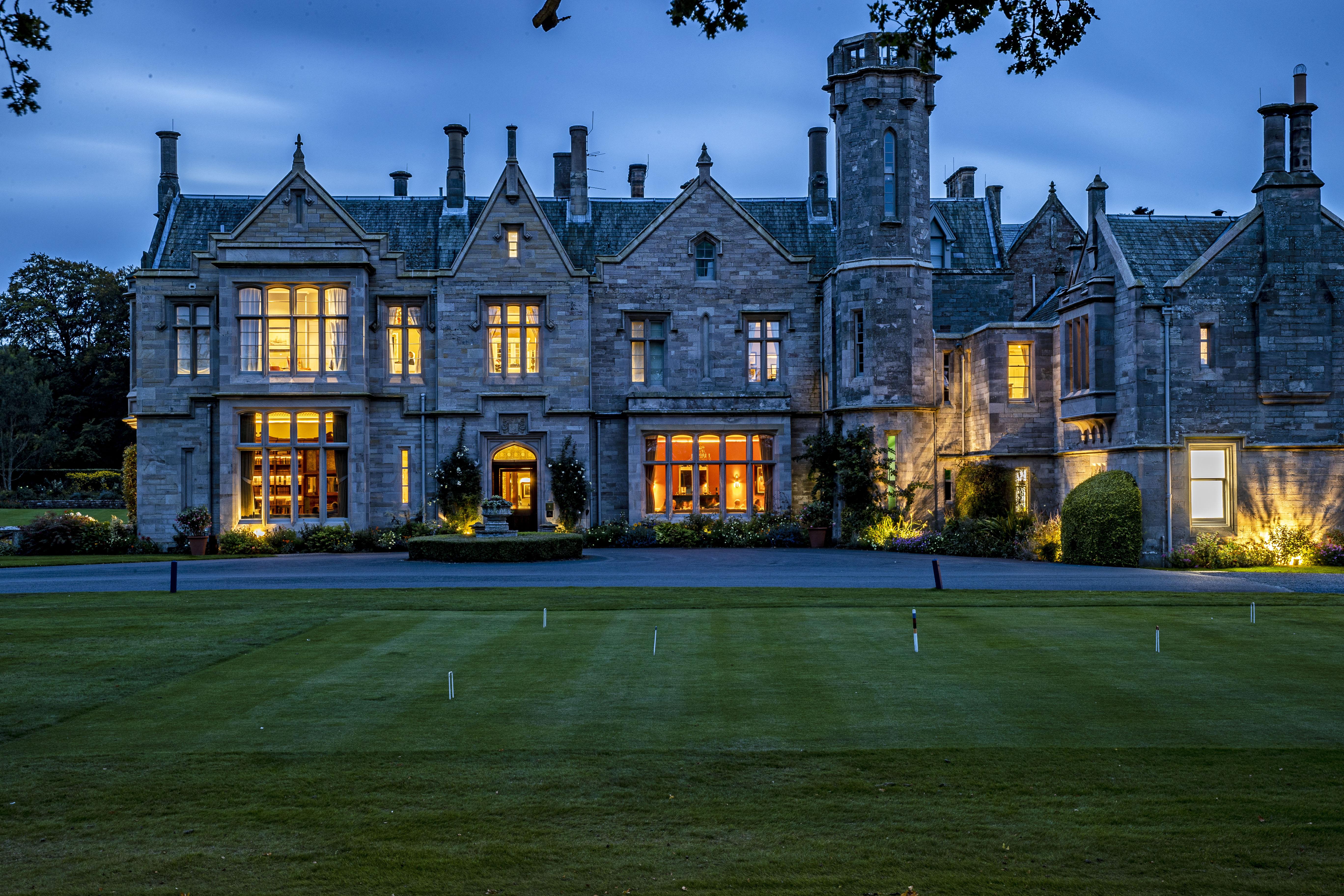 Schloss Roxburghe, Part Of Destination By Hyatt Exterior foto The main house at night